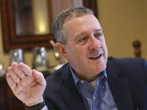 FILE - In this Nov. 19, 2019, photo James Bullard, president of the St. Louis Federal Reserve Bank, gestures during an interview in Richmond, Va. The Federal Reserve may have to raise its benchmark interest rate much higher than many people expect to get inflation under control, Bullard said Thursday, Nov. 17, 2022.