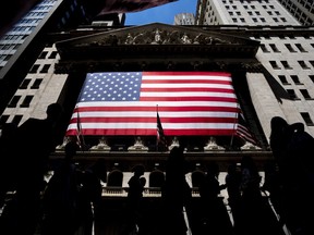 People walk past the New York Stock Exchange on Wednesday, June 29, 2022 in New York. Stocks are opening lower across the board on Wall Street, Tuesday, July 5, and crude oil prices are dropping again. Treasury yields also fell as traders continued to worry about the state of the economy