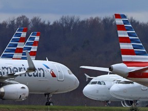FILE - In this Tuesday, March 31, 2020, file photo, these are some of the 88 American Airlines planes stored at Pittsburgh International Airport in Imperial, Pa. The government and two major airlines are giving starkly contrasting views about the impact of an alliance between the airlines. Closing arguments were held Friday, Nov. 18, 2022, in federal district court in the government's lawsuit to break up a partnership between American Airlines and JetBlue.