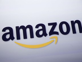 FILE - The Amazon logo is displayed at a news conference in New York on Sept. 28, 2011. Amazon Music is gearing up for a massive content expansion: The streaming giant will offer a full catalog of music with more than 100 million songs for members.
