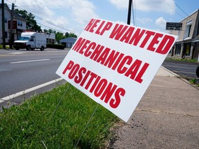 FILE - A help wanted sign is posted on the side of a road in Warminster, Pa., Thursday, June 2, 2022. The Labor Department reports Thursday, Nov. 17, on the number of people who applied for unemployment benefits last week.