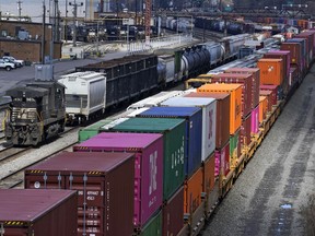 FILE - This April 2, 2021, file photo shows freight train cars and containers at Norfolk Southern Railroad's Conway Yard in Conway, Pa. Railroad engineers accepted their deal with the railroads that will deliver 24% raises but conductors rejected the contract casting more doubt on whether the industry will be able to resolve the labor dispute before next month's deadline without Congress' help. The votes, Monday, Nov. 21, 2022, by the two biggest railroad unions follows the decision by three other unions to reject their deals with the railroads that the Biden administration helped broker before the original strike deadline in September.