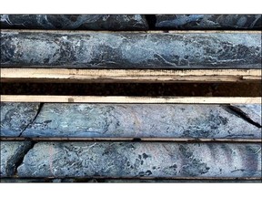 Photograph of drill core with 2.2% TREO and 19% P205 at 219m in hole HK22-013.  Rare earth element mineralization is amongst a myriad of carbonatite dykes (phoscorite and sovite) which themselves are cut by fluorite-rich carbonate veins. Protolith alkaline igneous rocks are completely replaced by a potassic alteration assemblage dominated by hydrothermal biotite.