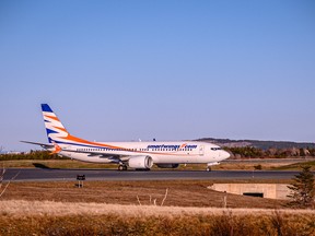 The first Ukrainian refugee airlift touches down in St. John's, May 9, 2022.