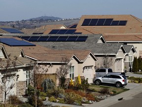 FILE--Solar panels sit on rooftops at a housing development in Folsom, Calif., Wednesday, Feb. 12, 2020. California regulators on Thursday, Nov 10, 2022 proposed changes to the state's residential solar market aimed at encouraging more at-home battery systems that can help the electrical grid rely less on fossil fuels in the evenings, especially during heat waves. The state has the nation's largest rooftop solar market with panels on about 1.5 million nomes, according to the California Public Utilities Commission. .