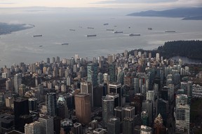 Container ships sit in the Burrand Inlet just outside of the Port of Vancouver.