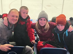 Oleh and Anastasiia Sysa, and their sons, Danny and David, take in a Newfoundland Growlers game on a recent Friday night.