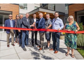 Project partners cut the ribbon at the grand opening of Uplands Terrace Apartments at 6117 Uplands Drive, Nanaimo, British Columbia.