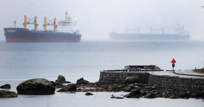 A container ship port is enveloped in a morning mist at dawn inside the inner harbour of Vancouver. The city gets five millimetres or more of rain on about 75 days every year, and it gets 10 millimetres or more on 41 days.