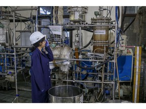 A worker observes the bio jet fuel production at Council Of Scientific And Industrial Research, Indian Institute of Petroleum in Dehradun, India, on Friday, Oct. 7, 2022.