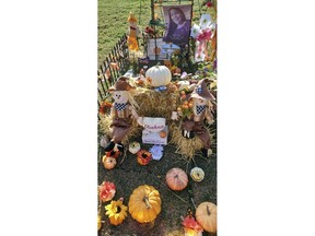 The gravesite of 10-year-old Eliahna Torres, who was one of 19 children and two teachers massacred at their elementary school in Uvalde, Texas, is shown with seasonal decorations. Sandra Torres, the mother of Eliahna Torres, filed a federal lawsuit Monday, Nov. 28, 2022, against police, the school district and the maker of the gun used in the massacre. (Sandra Torres via AP)