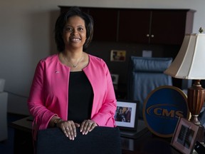 FILE - Chiquita Brooks-LaSure, the Administrator for the Centers of Medicare and Medicaid Services, poses for a photograph in her office, Wednesday, Feb. 9, 2022, in Washington. With Medicare's open enrollment underway, health experts are warning older adults about an uptick in misleading marketing tactics that might lead some to sign up for Medicare Advantage plans that don't cover their doctors or prescriptions and drive up their out-of-pocket costs.