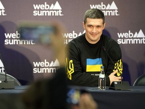 Ukraine's Minister of Digital Transformation Mykhailo Fedorov smiles during a news conference at the Web Summit technology conference in Lisbon, Portugal, Thursday, Nov. 3, 2022.