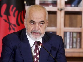 This photo provided by Albanian Prime Minister's Office shows Albania's Prime Minister Edi Rama speaking at a news conference denouncing Britain's "calculated attack" on his country referring to the increased number of Albanian migrants entering the island, in Tirana, Tuesday, Nov. 15, 2022. Britain has seen more than 40,000 migrants crossing the English Channel this year, a record high with one-third of them Albanians, which Home Secretary Suella Braverman described as an "invasion on our southern coast" also riling Albania by blaming Albanian criminal gangs for "abusing" Britain's asylum system and modern slavery laws. (Albania Prime Minister's Office via AP)