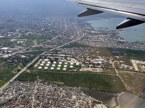 A fuel terminal is seen from a plane in Port-au-Prince, Haiti, Friday, Nov. 4, 2022. Haiti's National Police has been fighting to remove a powerful gang that surrounded the key fuel terminal in Port-au-Prince for almost two months -- though it's not immediately clear if the blockade has been fully lifted.