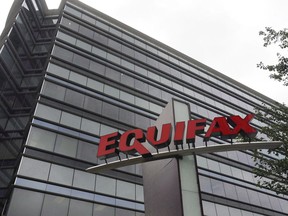 The Equifax Inc., offices in Atlanta are shown on July 21, 2012.&ampnbsp;Equifax Canada says an increase in borrowers helped push total consumer debt to $2.36 trillion in the third quarter for a 7.3 per cent rise from last year even as mortgage volumes decline.