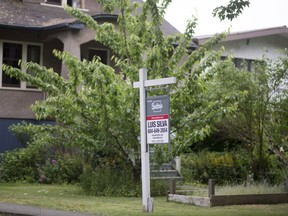 A real estate sign is pictured in Vancouver, B.C., Tuesday, June 12, 2018.&ampnbsp;A new report says Canada's housing market is still firmly in correction mode, despite having slowed in recent months.