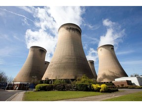 Cooling towers stand within the Drax Group Plc.'s power station complex near Selby, U.K. Photographer: Simon Dawson/Bloomberg
