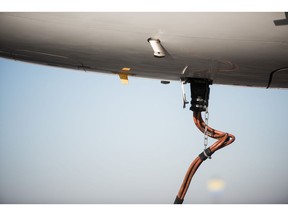 A refueling pipe sits connected to the tank of an Airbus A321-231 passenger aircraft, operated by Wizz Air Holdings Plc, at Liszt Ferenc airport in Budapest, Hungary, on Monday, Jan. 9, 2017. Wizz Air, the No. 1 no-frills carrier in Eastern Europe, grew passenger numbers 19 percent to 23 million as it added more destinations in the west of the continent. Photographer: Akos Stiller/Bloomberg