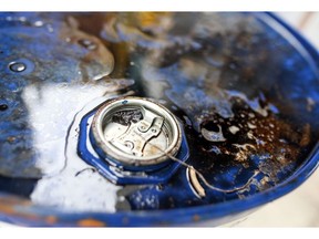 Excess fluid sits on the top of a barrel of oil based lubricant at Rock Oil Ltd's factory in Warrington, U.K., on Monday, March 13, 2017. Oil declined after Saudi Arabia told OPEC it raised production back above 10 million barrels a day in February, reversing about a third of the cuts it made the previous month. Photographer: Chris Ratcliffe/Bloomberg