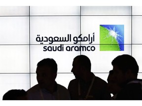 A Saudi Arabian Oil Co. (Aramco) logo sits on an electronic display at the company's corporate pavilion during the 22nd World Petroleum Congress in Istanbul, Turkey, on Wednesday, July 12, 2017. Oil fell from the lowest closing price in two weeks as talk of Libya and Nigeria being requested to cap their production failed to dispel doubts about the effectiveness of OPEC's cut. Photographer: Kostas Tsironis/Bloomberg