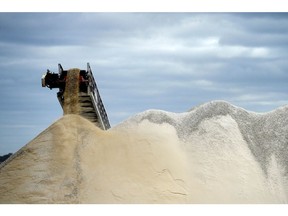 Lithium ore falls from a chute onto a stockpile at the Bald Hill lithium mine site, co-owned by Tawana Resources Ltd. and Alliance Mineral Assets Ltd., outside of Widgiemooltha, Australia, on Monday, Aug. 6, 2018. Australia's newest lithium exporter Tawana is in talks with potential customers over expansion of its Bald Hill mine and sees no risk of an oversupply that would send prices lower.
