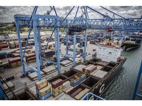 A ship-to-shore crane loads containers onto a cargo ship at Mombasa port, operated by Kenya Ports Authority, in Mombasa, Kenya, on Saturday, Sept. 1, 2018. China's modern-day adaptation of the Silk Road, known as the Belt and Road Initiative, aims to revive and extend trading routes connecting China with Central Asia, the Middle East, Africa and Europe via networks of upgraded or new railways, ports, pipelines, power grids and highways. Photographer: Luis Tato/Bloomberg