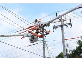 Pike Electric employees prepare power lines ahead of Hurricane Dorian in Fort Lauderdale, Florida, U.S., on Thursday, Aug. 29, 2019. Hurricane Dorian is now expected to become a Category 4 storm, with winds reaching 130 miles per hour within 72 hours as it barrels toward Florida's east coast, aiming to become the first major hurricane to hit that area in 15 years.