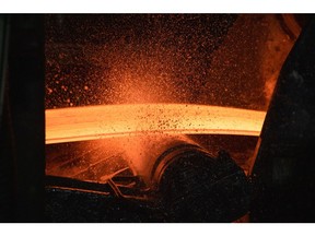 A red hot steel slab passes along a rolling machine in the rolling shop at the Cherepovets Steel Mill, operated by Severstal PJSC, in Cherepovets, Russia, on Friday, Dec. 3, 2021. Even if the recently-identified omicron variant proves less deadly than feared, traders are weighing a weakening growth outlook that could hurt demand for industrial commodities in the months ahead. Photographer: Andrey Rudakov/Bloomberg