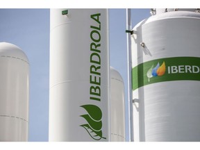 The Iberdrola logo on hydrogen storage tanks during the final stages of construction at Iberdola SA's Puertollano green hydrogen plant in Puertollano, Spain, on Thursday, May 19, 2022. The new plant will be Europe's largest production site for green hydrogen for industrial use. Photographer: Angel Garcia/Bloomberg