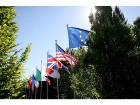 Flags of the Group of Seven (G-7) nations and the European Union (EU) at the Schloss Elmau luxury hotel on the opening day of the leaders summit in Elmau, Germany, on Sunday, June 26, 2022. Issues on Sunday's formal agenda include the global economy, infrastructure and investment and foreign and security policy, while a number of bilateral meetings are also planned.
