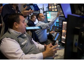 Traders work on the floor of the New York Stock Exchange (NYSE) in New York, US, on Wednesday, Nov. 9, 2022. US stocks declined following midterm elections that failed to yield a Republican sweep. Treasuries and the dollar caught bids in a sign of deteriorating risk sentiment.