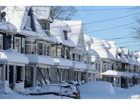 Buffalo, NY - November 20:Snow covered homes after an intense lake-effect snowstorm that impacted the area on November 20, 2022 in Buffalo, New York. Around Buffalo and the surrounding suburbs, the snowstorm resulted in up to six feet of accumulation and has been attributed to at least three deaths. The band of snow is expected to weaken overnight with milder temperatures expected.