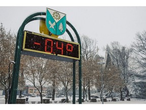 An outdoor thermometer reads -0.4 degrees centigrade in a village near the open cast lignite mine outside Belchatow, Poland, on Thursday, Nov. 24, 20212. Poland's use of coal makes it an outlier among the 27-member European Union, the country of 38 million people accounts for 77% of all the households in the bloc that still use coal for heating. Photographer: Damian Lema?ski/Bloomberg