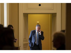 Senator Joe Manchin, a Democrat from West Virginia, speaks on the phone during the weekly Democratic caucus luncheon at the US Capitol in Washington, DC, US, on Tuesday, Nov. 29, 2022. A short-term stopgap funding bill to delay a December 16 shutdown deadline appears increasingly likely as negotiators have made little concrete progress toward a full government funding package.