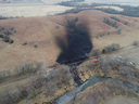 Emergency crews work on Dec. 9 to clean up an oil spill following a leak, in rural Washington County, Kan., from TC Energy's Keystone pipeline.