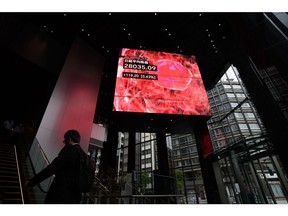 The Nikkei 225 Stock Average displayed on a rotating-cube screen in an atrium of the Kabuto One building, next the Tokyo Stock Exchange, in Tokyo, Japan, on Tuesday, June 7, 2022.  Photographer: Akio Kon/Bloomberg