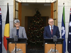 Australian Prime Minister Anthony Albanese, right, and Foreign Affairs Minister Penny Wong hold a joint press conference at Parliament House in Canberra, Australia, Tuesday, Dec. 20, 2022. The first visit by an Australian foreign minister to China in four years is raising hopes that Australia will make progress on ending trade sanctions and freeing two Australian citizens detained in China.