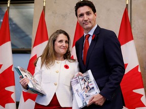 Canada's Deputy Prime Minister and Minister of Finance Chrystia Freeland and Prime Minister Justin Trudeau stop for a photo before delivering the fall economic statement in Ottawa on Nov. 3.