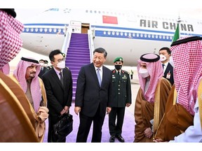 Xi Jinping is welcomed by Emir of Riyadh Faisal bin Bende bin Abdulaziz, left, on Dec. 7. Source: Saudi Arabian Foreign Ministry/Anadolu Agency/Getty Images