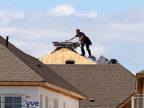 A construction worker works on a new home in Ottawa.