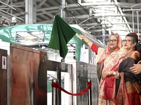 This handout photo provided by the Bangladesh Prime Minister's Office shows Prime Minister Sheikh Hasina inaugurate the country's first metro rail service in Dhaka, Bangladesh, Wednesday, Dec, 28, 2022. Bangladesh launched its first metro rail service, mostly funded by Japan, in the densely populated capital on Wednesday amid enthusiasm that the South Asian country's development bonanza would continue with both domestic and overseas funds. (Bangladesh Prime Minister's Office via AP)