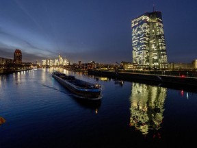 FILE - The European Central Bank is located near the river Main in Frankfurt, Germany, Tuesday, Dec. 13, 2022. The ECB could slow its record pace of interest rate increases. Analysts say Thursday's meeting could see an increase of half a percentage point instead of three-quarters of a point after inflation fell unexpectedly in November.