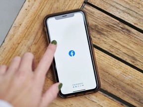 The Facebook logo on a smartphone.