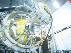 An employee with General Fusion's P13 plasma injector at the company's Vancouver lab.