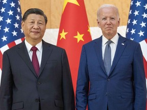 U.S. President Joe Biden, right, stands with Chinese President Xi Jinping before a meeting on the sidelines of the G20 summit meeting, Monday, Nov. 14, 2022, in Bali, Indonesia.