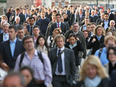 A crowd of people walking to work.