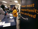 Job seekers attend a job fair in Calgary last month. 
