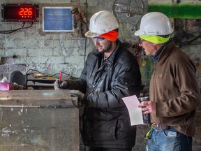 Josh Kaminsky, left, and his father Arthur Kaminsky, right, at Canada Iron & Metal.