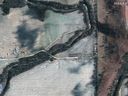 A satellite image shows emergency crews working to clean up the crude oil spill along Mill Creek following the leak at the Keystone pipeline operated by TC Energy in Kansas. 

